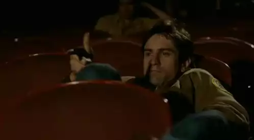 Travis Bickle Pensive in Cinema